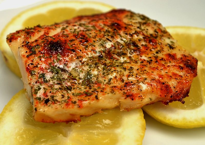 A bed of lemons adds the sourness to offset the oily tasty or some species of fish