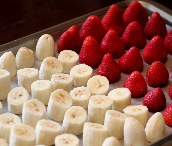 Cut the fruit into individual portions and freeze separately
